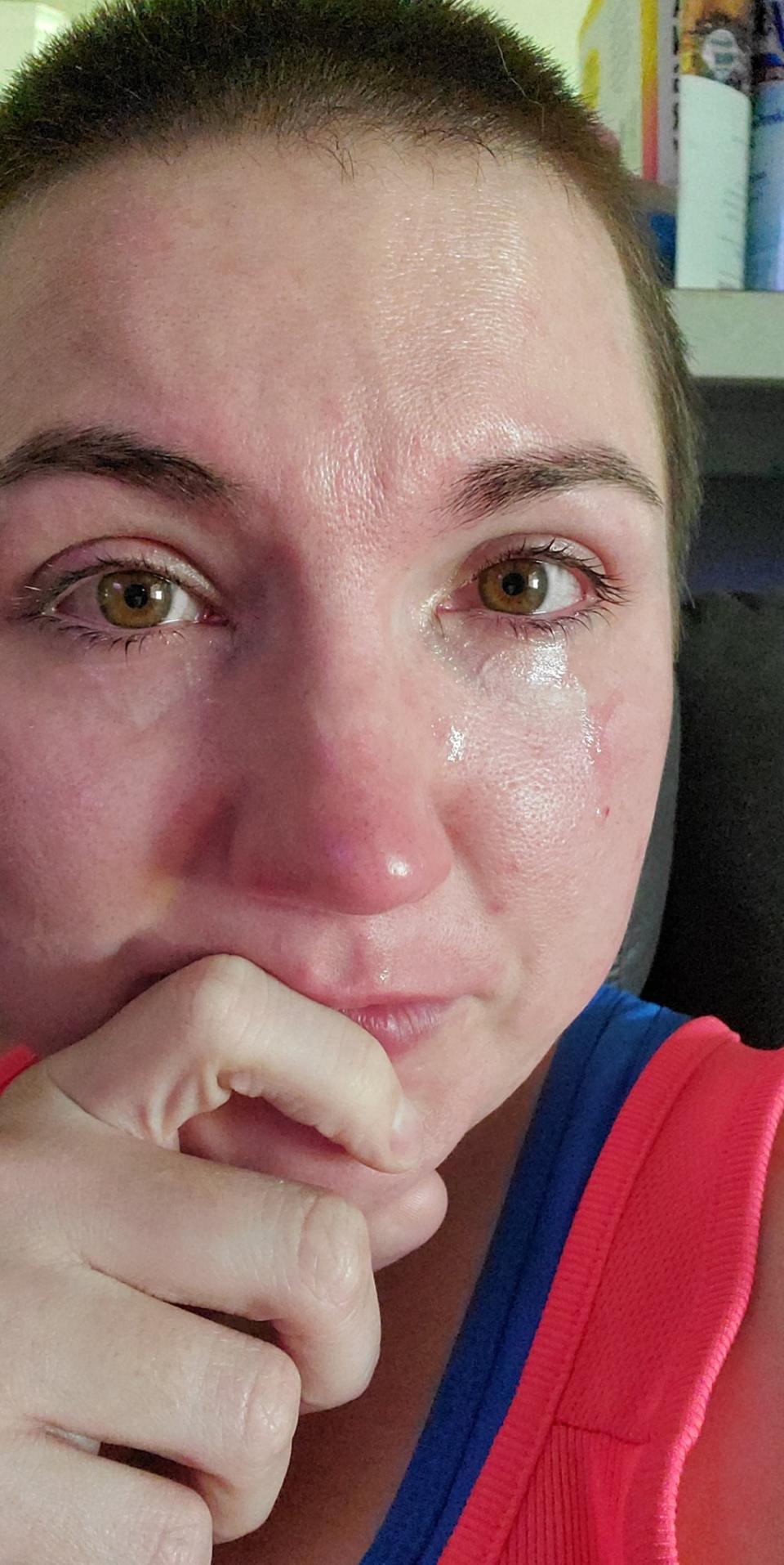 Ms Oechsle shared this tearful selfie after making the decision to leave her daughter with a family friend until the pandemic is over. Source: Facebook