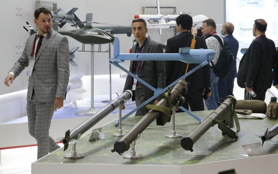 Visitors browse weapons at the Army 2022 arms expo - Getty Images