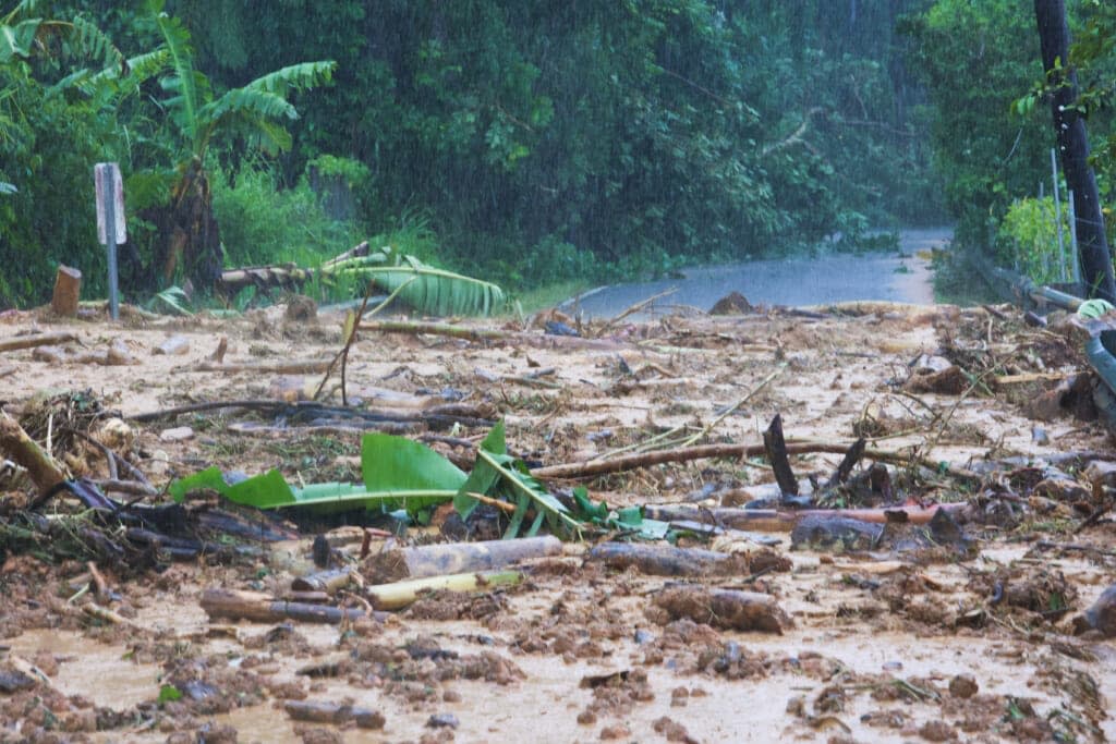 A road is blocked by a mudslide caused by Hurricane Fiona in Cayey, Puerto Rico, Sunday, Sept. 18, 2022. (AP Photo/Stephanie Rojas)