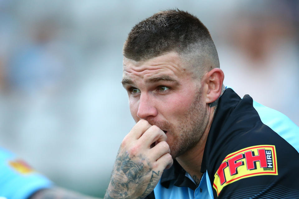 Pictured here, Cronulla Sharks player Josh Dugan watches on during a pre-season game.