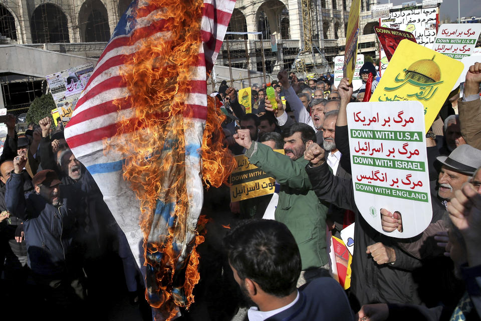 <p>Iranian worshippers burn representation of U.S. flag in a rally after Friday prayer in Tehran, Iran, Friday, Dec. 8, 2017. (Photo: Ebrahim Noroozi/AP) </p>