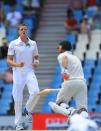 South Africa's bowler Morne Morkel, left, reacts after a teammate dropped a catch off Australia's batsman David Warner, right, on the third day of their their cricket Test match at Centurion Park in Pretoria, South Africa, Friday, Feb. 14, 2014. (AP Photo/ Themba Hadebe)