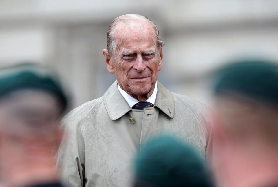 Britain's Prince Philip, Duke of Edinburgh, in his role as Captain General, Royal Marines, attends a Parade to mark the finale of the 1664 Global Challenge on the Buckingham Palace Forecourt in central London on August 2, 2017.  
Prince Philip, the 96-year-old husband of Queen Elizabeth II, conducted his final solo public engagement on August 2, 2017, overseeing a military parade in the pouring rain before retiring from a lifetime of service. The Duke of Edinburgh, wearing a raincoat and bowler hat, met members of the Royal Marines and veterans -- many younger than him -- before taking the salute in the forecourt of Buckingham Palace.

 / AFP PHOTO / POOL / Yui Mok        (Photo credit should read YUI MOK/AFP via Getty Images)