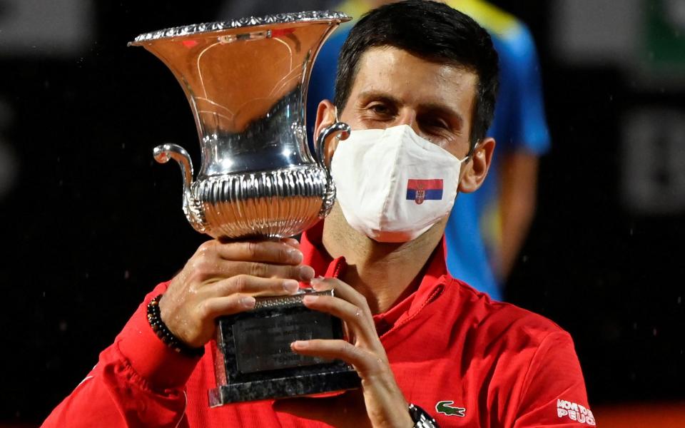 Novak Djokovic celebrates with the trophy after winning the final against Diego Schwartzman - REUTERS