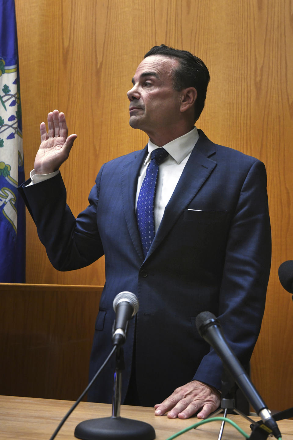 Bridgeport, Conn., Mayor Joe Ganim is sworn in prior to testifying during a hearing in Bridgeport Superior Court, Tuesday, Oct. 17, 2023, in Bridgeport. (Ned Gerard/Hearst Connecticut Media via AP, Pool)