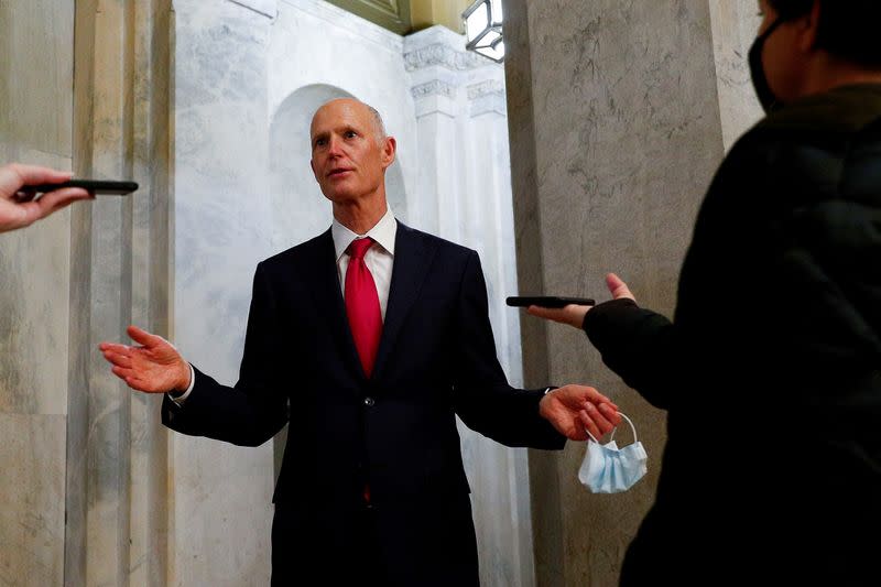 FILE PHOTO: Senator Rick Scott (R-FL) speaks to news reporters after departing from the Senate Floor, as the coronavirus disease (COVID-19) outbreak continues in Washington