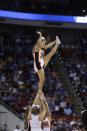 Mercer cheerleaders perform during the first half of an NCAA college basketball second-round game against Duke, Friday, March 21, 2014, in Raleigh, N.C. (AP Photo/Chuck Burton)
