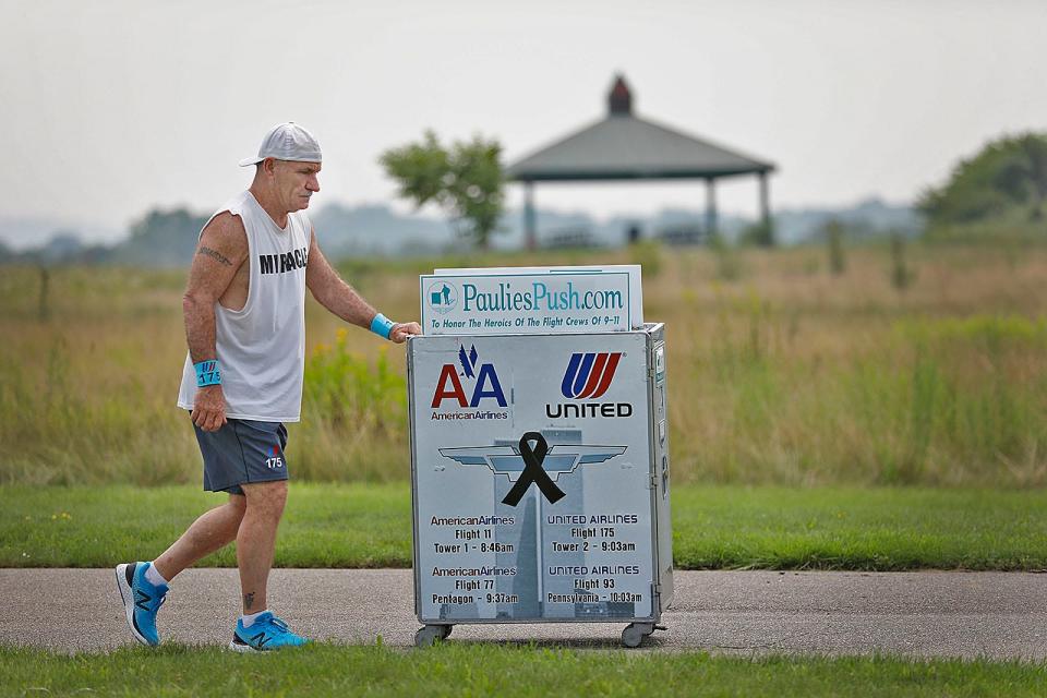 Paul Veneto, of Braintree, a former United Airlines flight attendant, pushed a drink cart from Logan Airport to ground zero in New York to memorialize friends he lost in the 9/11 attacks.