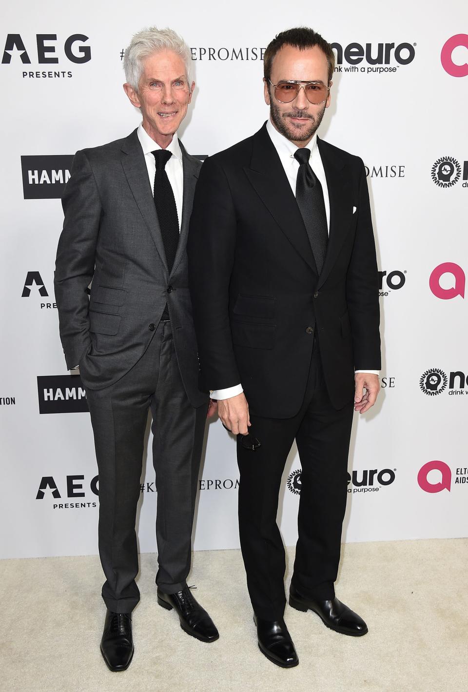 In this file photo, Richard Buckley and Tom Ford arrive at Elton John's 70th birthday party Mar. 25, 2017 in Los Angeles.