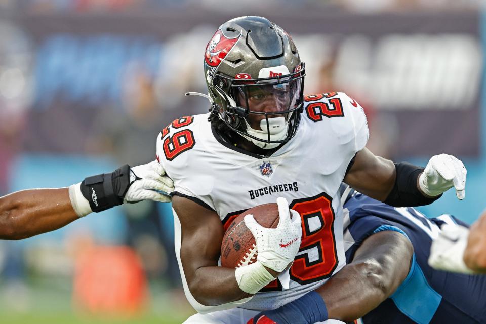 Tampa Bay Buccaneers running back Rachaad White (29) is tackled during their game against the Tennessee Titans Saturday, Aug. 20, 2022, in Nashville, Tenn. (AP Photo/Wade Payne)