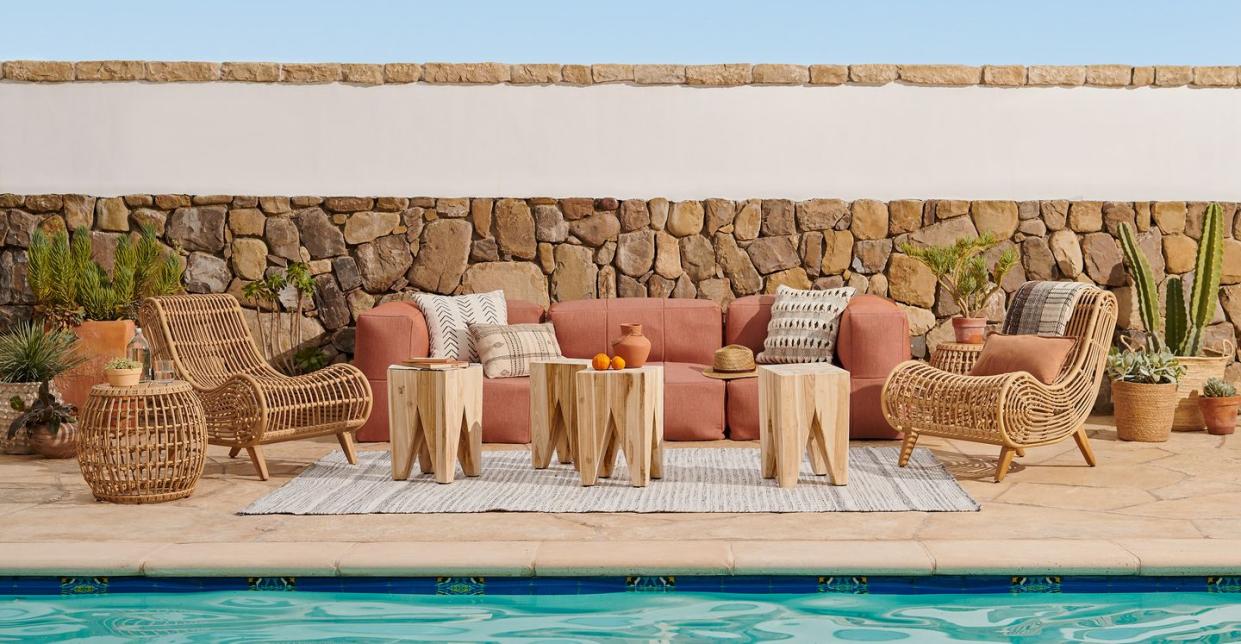 a pool with chairs and a table