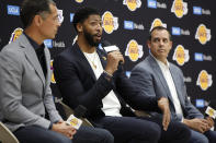 Los Angeles Lakers NBA basketball team general manager Rob Pelinka, left, and Head Coach Frank Vogel, right, introduce Anthony Davis at a news conference at the UCLA Health Training Center in El Segundo, Calif., Saturday, July 13, 2019 (AP Photo/Damian Dovarganes)