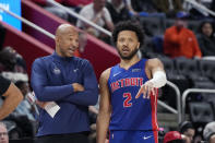 Detroit Pistons head coach Monty Williams talks with guard Cade Cunningham during the second half of an NBA basketball game against the Charlotte Hornets, Monday, March 11, 2024, in Detroit. (AP Photo/Carlos Osorio)