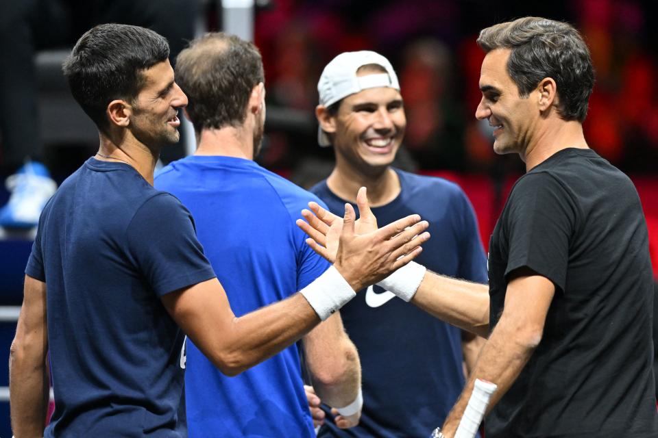 Roger Federer, Novak Djokovic, Rafael Nada and Andy Murray shake hands after a practice session.