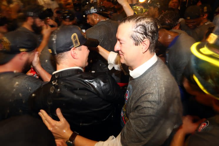 Theo Epstein and Cubs owner Tom Ricketts embrace after the Cubs won the World Series. (Getty Images)