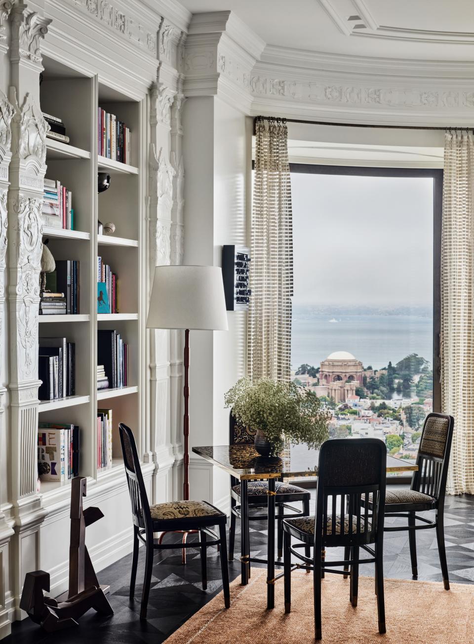 Antique Anton Lorenz chairs and a vintage Jacques Adnet floor lamp in the family room.