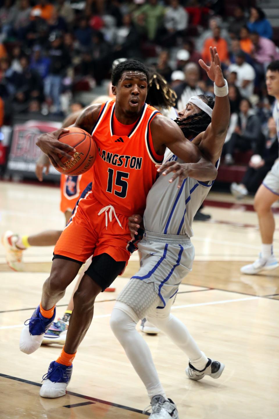 Langston's Cortez Mosley tries to get around OCU's Dravon Clayborn during a men's college basketball game last year in Oklahoma City.