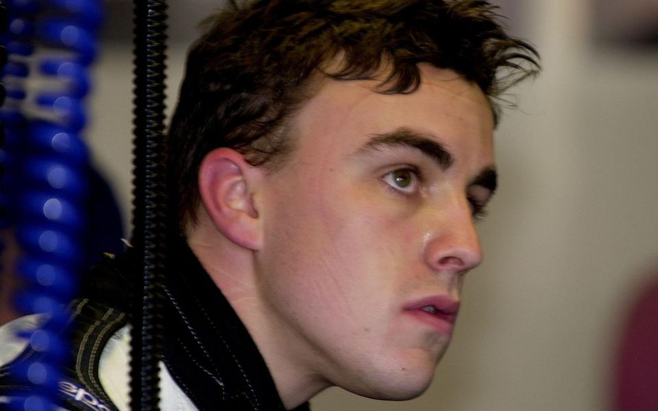 Formula One driver rookie driver Fernando Alonso of Spain looks at the timing screen during the first practice session in Melbourne, Australia, Friday Mar. 2, 2001. The Australian Grand Prix will be raced on Sunday Mar. 4. - TELEMMGLPICT000001162080_1