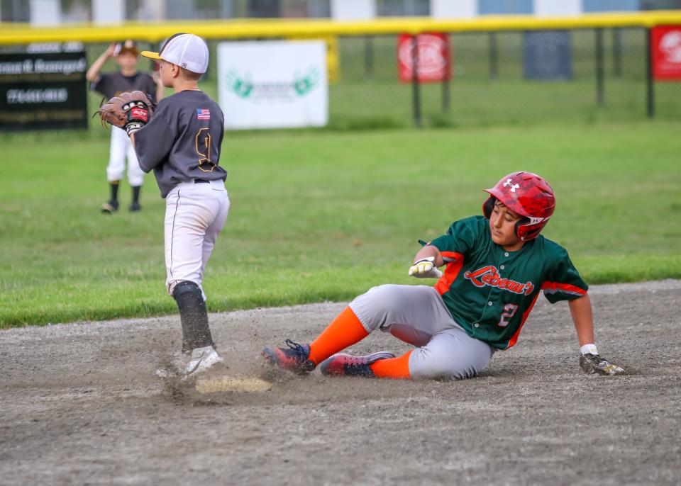 Ben Viera of LeBeau's slides safely into second base while Southcoast Towing second baseman Camdyn Messier awaits the throw from the outfield. LeBeau's won by a score of 8-5.
