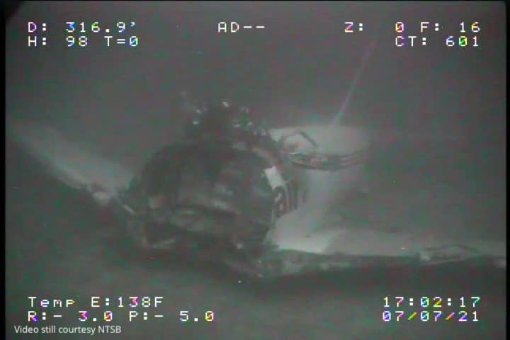 ADDS ADDITIONAL SOURCE INFORMATION - In this Wednesday, July 7, 2021, image from video provided by Sea Engineering, Inc. via the National Transportation Safety Board, the jet body from Transair Flight 810 rests on the Pacific Ocean floor off the coast of Honolulu, Hawaii. The NTSB located the aircraft on the Pacific Ocean floor approximately 2 miles from Ewa Beach. The fuselage split into 2 sections, breaking just forward of the wings. On July 2, the pilots of the Transair Flight 810 reported engine trouble and were attempting to return to Honolulu when they were forced to land the Boeing 737 in the water, the Federal Aviation Administration said in a statement. (Sea Engineering, Inc./NTSB via AP)