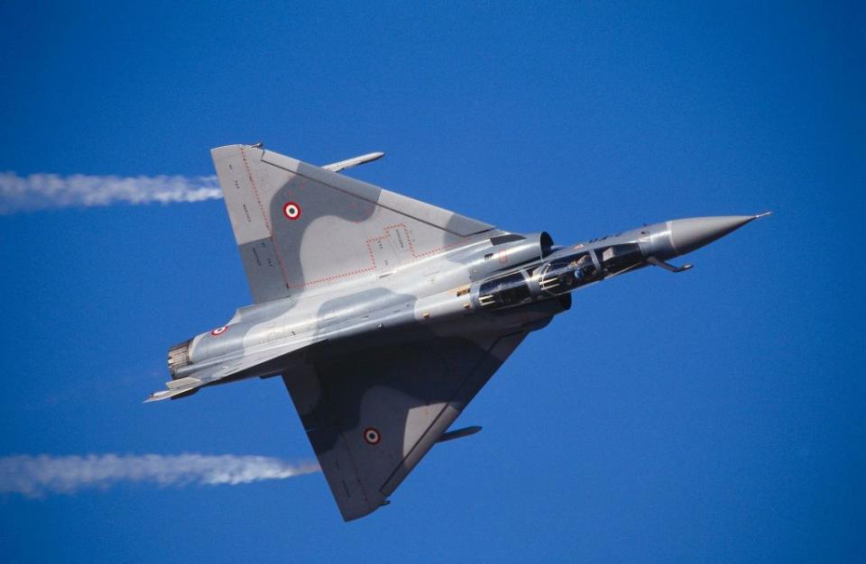 french airforce dassault mirage 2000 in the flying display with smoke at the 1997 dubai international air show