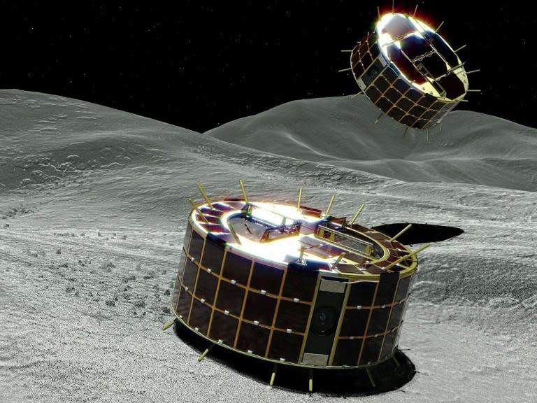 Artists impression of the Minerva-II-1 rovers landing on the surface of the Ryugu asteroid: JAXA