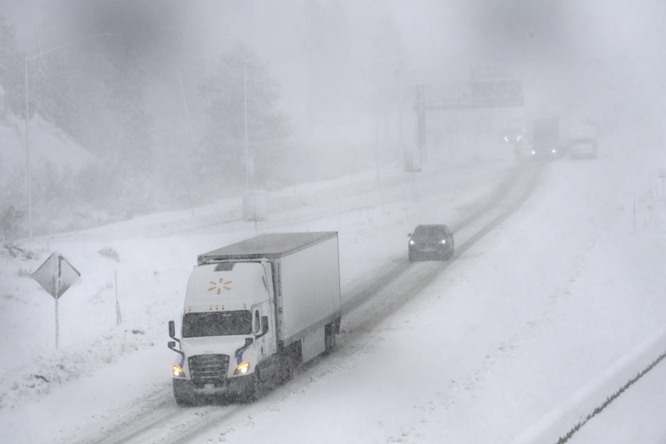 West bound traffic moves slowly on the I-80 at the Donner Pass Exit on Friday, March 1, 2024, in Truckee, Calif. The most powerful Pacific storm of the season is forecast to bring up to 10 feet of snow into the Sierra Nevada by the weekend. (AP Photo/Andy Barron)