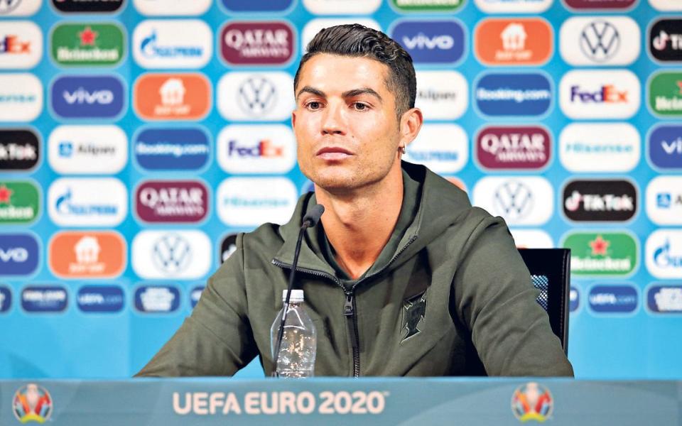 Footballer Cristiano Ronaldo dissolved into a spectacular sulk at a press conference for Euro press conference - UEFA via Getty Images