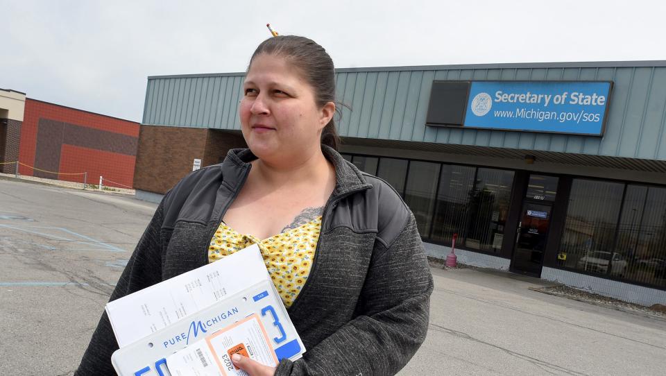 Maricella Ramirez, 34, was proud as she left the Secretary of State's office in Monroe with her driver's license permit and plate for her 2003 Ford Explorer.