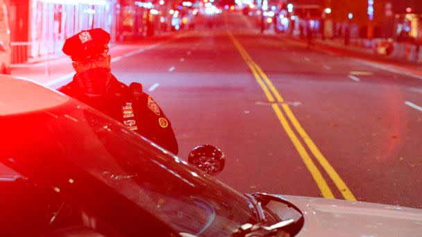 PHOTO: A NYPD officer stand guard at the closed 57th street at 5th Avenue the night before elections in New York, Nov. 2, 2020. (Kena Betancur/AFP via Getty Images, FILE)