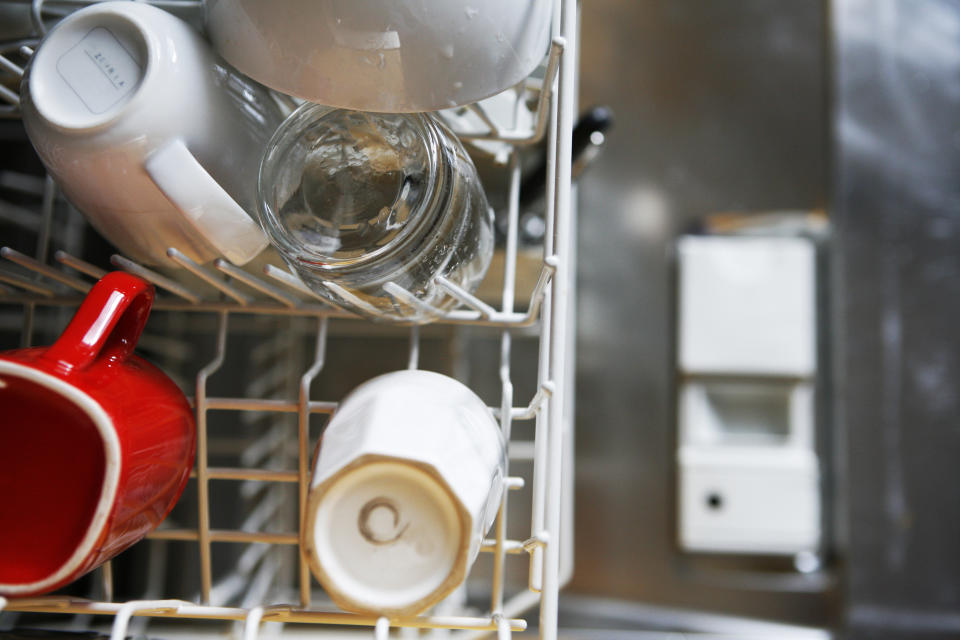 Clean mugs and glasses in dishwasher