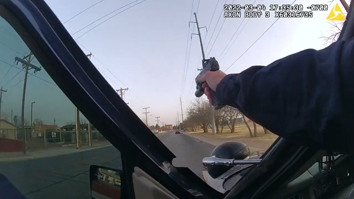 An LCPD officer fires his gun at Julian Valenzuela near the intersection of South Espina Street and Fearny Street on March 4, 2022.