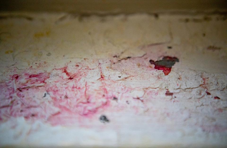 Chipped paint on a kitchen windowsill turns red, indicating the presence of lead in Kwmisha Adams' residence on Lindell Avenue in Louisville's Shawnee neighborhood. The house was built in the 1920s and has also tested positive for lead on the front door frame and in other areas in the home. Oct. 10, 2023