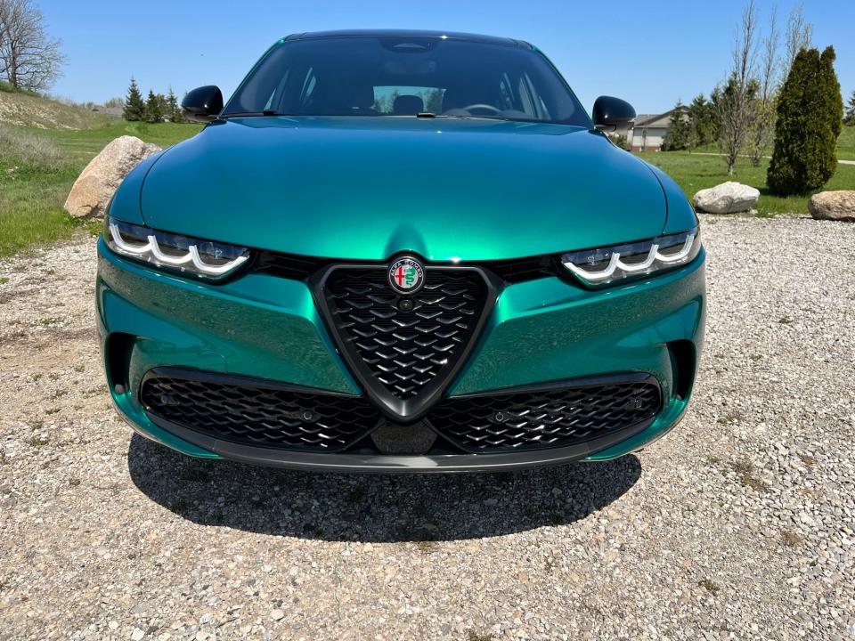 The 2024 Alfa Romeo Tonale PHEV SUV's grille, badge, V-shaped hood are among Alfa's signatures.