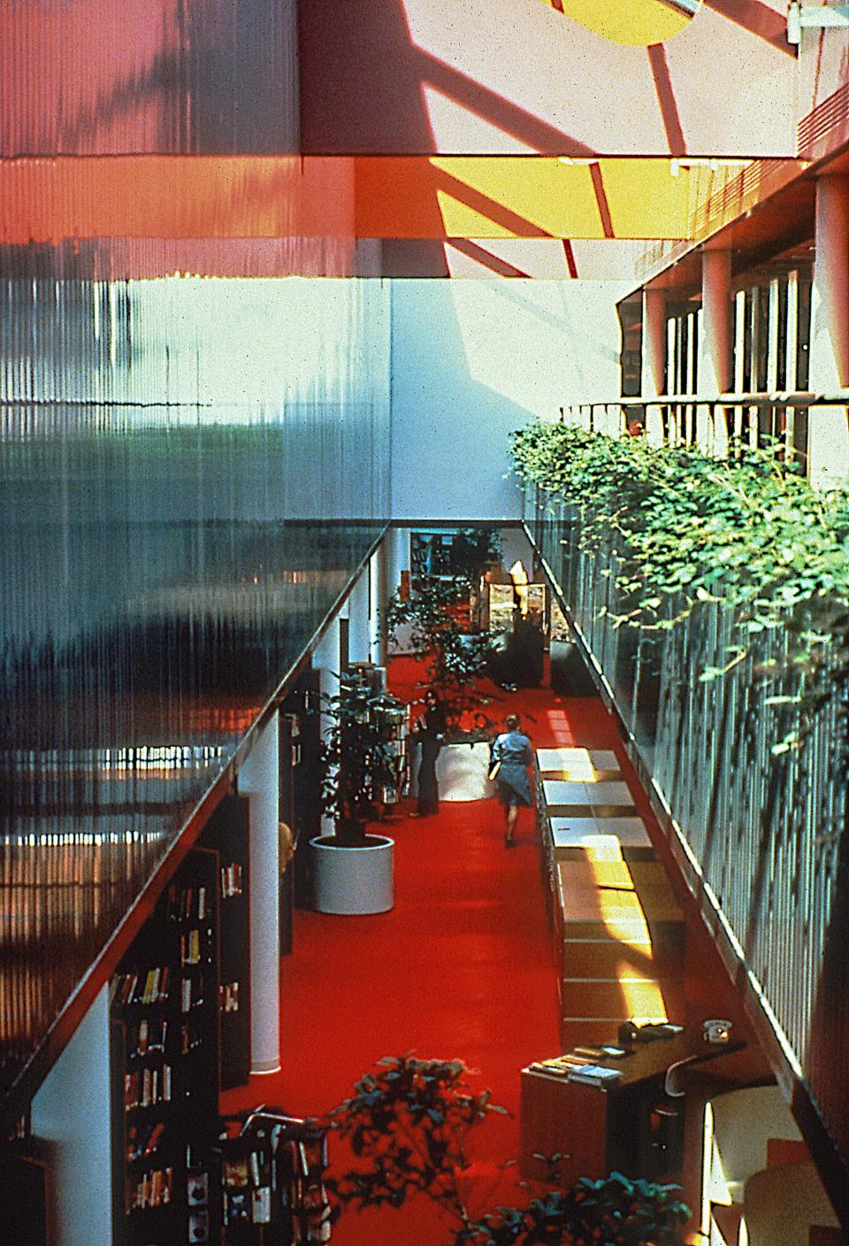 The interior of the Corning Public Library interior pictured in 1975. The bright, sky-lit interior was part of the original design by RTKL Architects, overseen by Edward Paul Haladay, AIA, RTKL Architects.