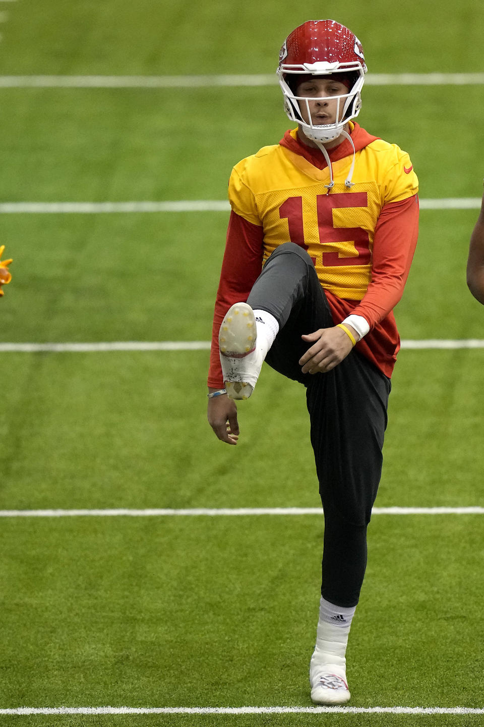 Kansas City Chiefs quarterback Patrick Mahomes stretches runs during an NFL football workout Thursday, Jan. 26, 2023, in Kansas City, Mo. The Chiefs are scheduled to play the Cincinnati Bengals Sunday in the AFC championship game. (AP Photo/Charlie Riedel)