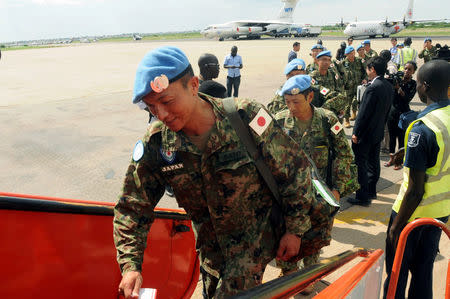 A Japanese soldier part of the last group of Japanese soldiers from the United Nations Mission in South Sudan (UNMISS) boards a plane at the Juba International Airport, as Japan withdraws from a mission in South Sudan, in Juba, South Sudan May 25, 2017. REUTERS/Jok Solomun