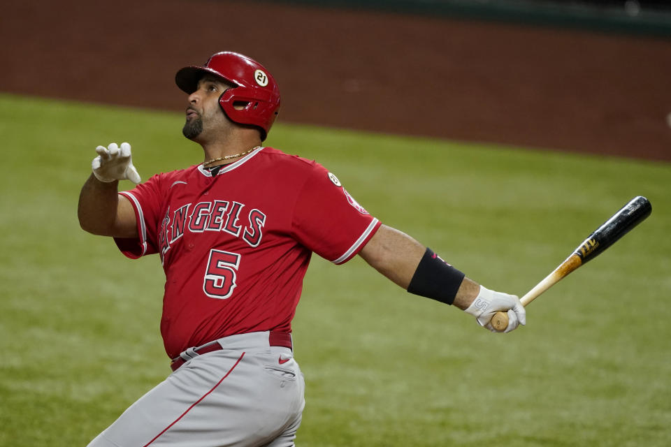 Los Angeles Angels' Albert Pujols follows through on a swing during a baseball game against the Texas Rangers in Arlington, Texas, Wednesday, Sept. 9, 2020. (AP Photo/Tony Gutierrez)