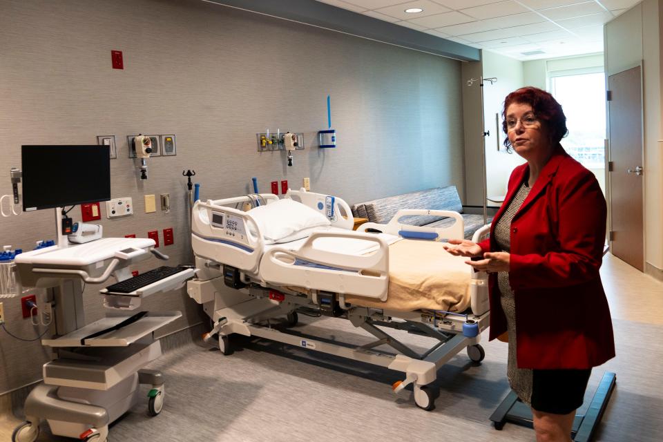 Dr. Kimberly DeStefano, medical director of maternal fetal medicine at the Women’s Center, shows off an antepartum room in the newly expanded center Friday.