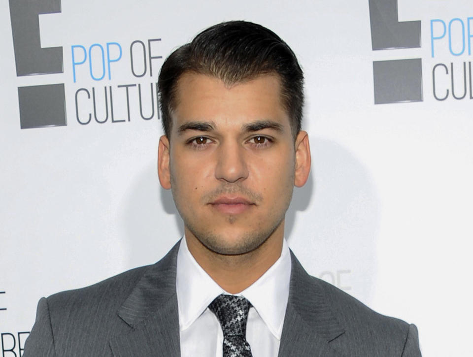 FILE - Rob Kardashian, from the show "Keeping Up With The Kardashians," attends an E! Network upfront event in New York on April 30, 2012. Kardashian testified Wednesday, April 27, 2022, that he feared for his life on a night in 2016 when his then-fiancée Blac Chyna pointed a gun at his head, pulled a phone-charging cable around his neck and repeatedly hit him with a metal rod while under the influence of substances. (AP Photo/Evan Agostini, File)