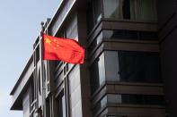 China’s national flag is seen waving at the China Consulate General in Houston, Texas