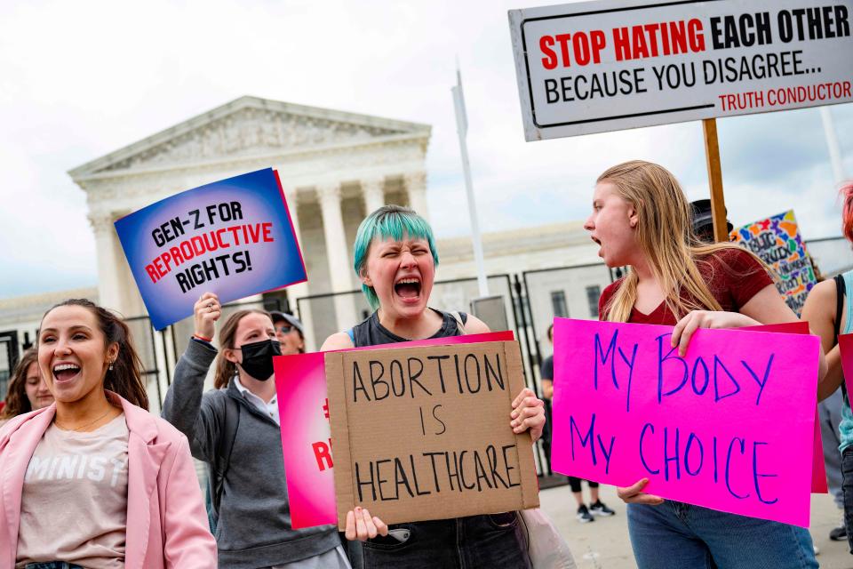 May 6, 2022: Pro-choice demonstrators chant in front of an un-scalable fence that stands around the US Supreme Court in Washington, DC.