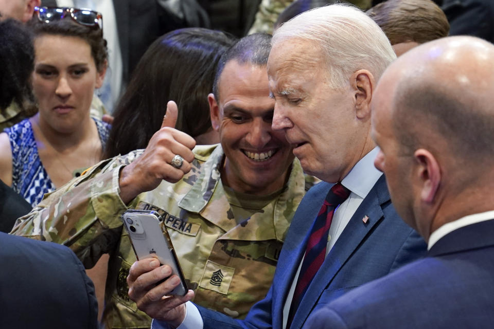 President Joe Biden takes a photo with a service member during a visit to Fort Liberty, N.C., Friday, June 9, 2023. (AP Photo/Susan Walsh)