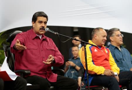 Venezuela's President Nicolas Maduro (L) speaks during a meeting with members of the Constituent Assembly in Caracas, Venezuela August 2, 2017. Miraflores Palace/Handout via REUTERS