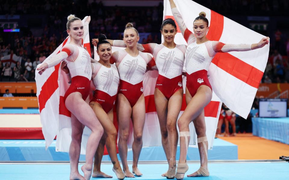 Women's Team Final and Individual Qualification - Subdivision 4 - Arena Birmingham, Birmingham, Britain - July 30, 2022 England's Georgia-Mea Fenton and teammates celebrate after winning gold  - REUTERS