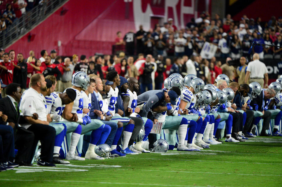 The Dallas Cowboys players, coaches and staff take a knee prior to standing for the National Anthem during a game against the Arizona Cardinals at University of Phoenix Stadium.&nbsp; (Photo: USA Today Sports / Reuters)