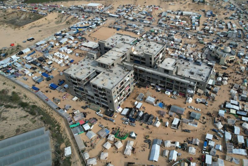 Makeshift tent camps house Palestinians displaced by intense Israeli bombardment on the Gaza Strip seeking refuge in open areas in Rafah near the Egyptian border on December 9. File Photo by Ismael Mohamad/UPI