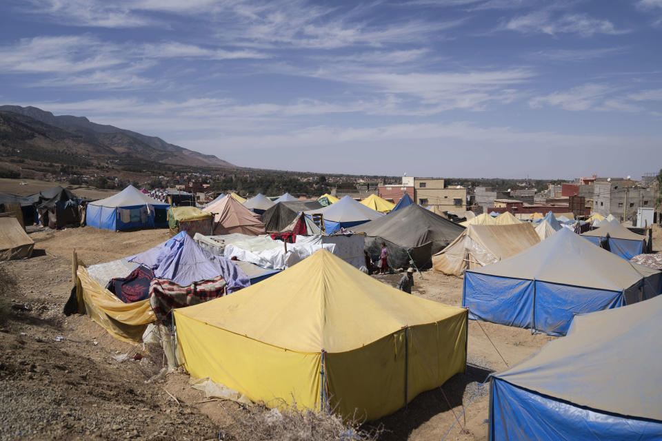 Tents housing people who were displaced by the earthquake are seen in the town of Amizmiz, outside Marrakech, Morocco, Friday, Oct. 6, 2023. Morocco has pledged to rebuild from a September earthquake in line with its architectural heritage. Villagers and architects agree that earthquake-safe construction is a top priority. That’s created a push for modern building materials. But the government says it wants to rebuild in line with Morocco’s cultural and architectural heritage. (AP Photo/Mosa'ab Elshamy)