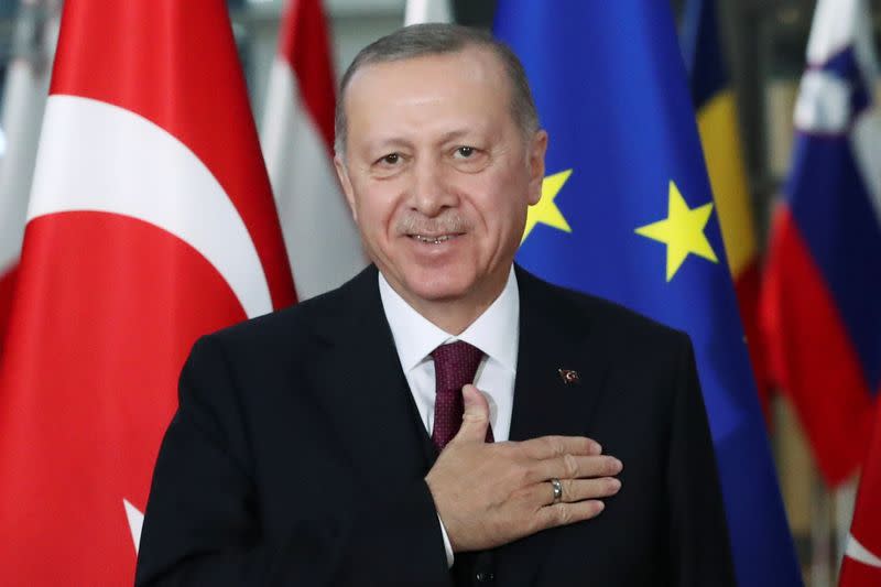 Turkish President Tayyip Erdogan reacts ahead of a meeting with EU Council President Charles Michel pose in Brussels