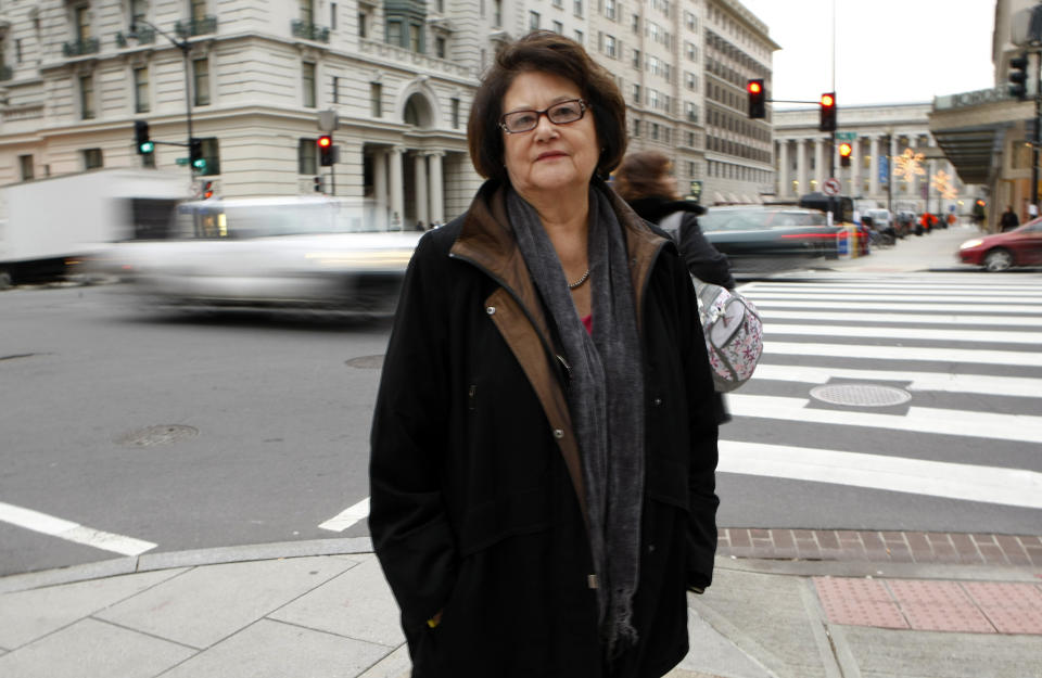 FILE - Elouise Cobell poses for a photo outside the law offices of Kilpatrick & Stockton on Dec. 8, 2009, in Washington. Cobell, known as “Yellow Bird Woman” (1945-2011), started the first bank established by a tribe on a reservation in Browning, Montana. (AP Photo/Gerald Herbert, File)